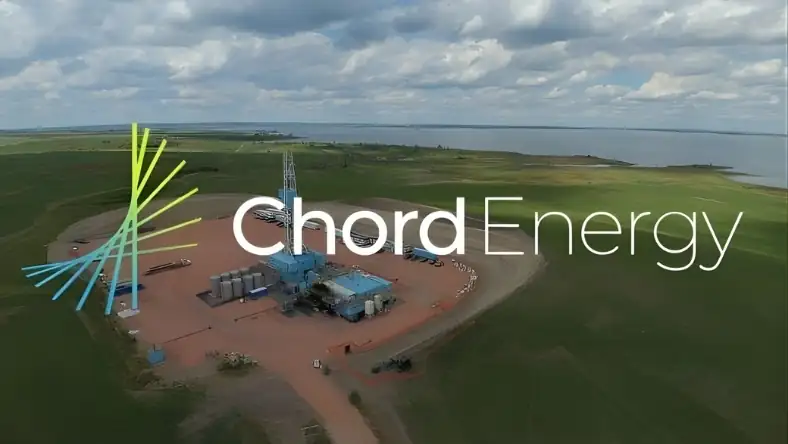 Aerial view of an onshore oil drilling site in a rural landscape