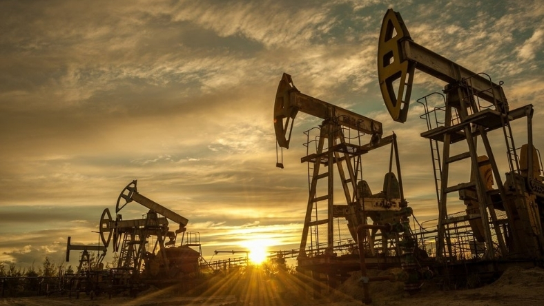 Oil pumpjacks operating in the Permian Basin during sunset