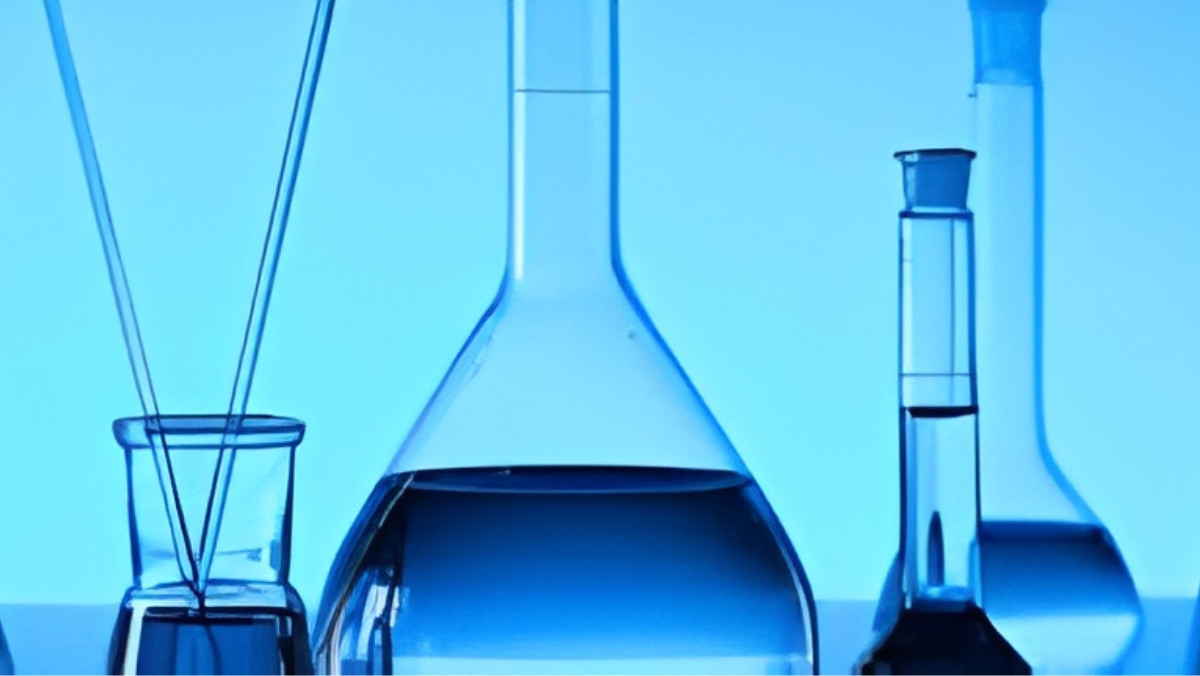 Laboratory glassware with blue liquid for chemical testing