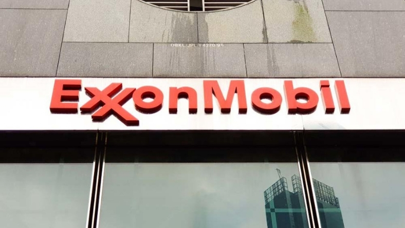 ExxonMobil red logo mounted on corporate building exterior