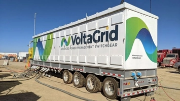VoltaGrid Advanced Power Management Switchgear trailer at an oilfield site